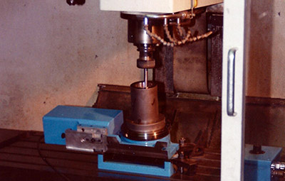 A rotary grinding table performing outside diameter milling work on a CNC machine